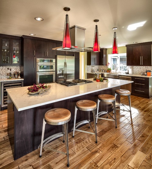 Cambria Torquay Countertop, Cambria Torquay Island Top, Beech Wood Mulberry Stained Cabinets, Toast Finish Birch Hardwood Flooring, Stainless Steel Appliance, Earth Tone Matchstick Backsplash and Red Pyramid Kitchen Pendants